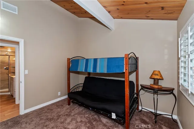 a room with a chair and a dresser