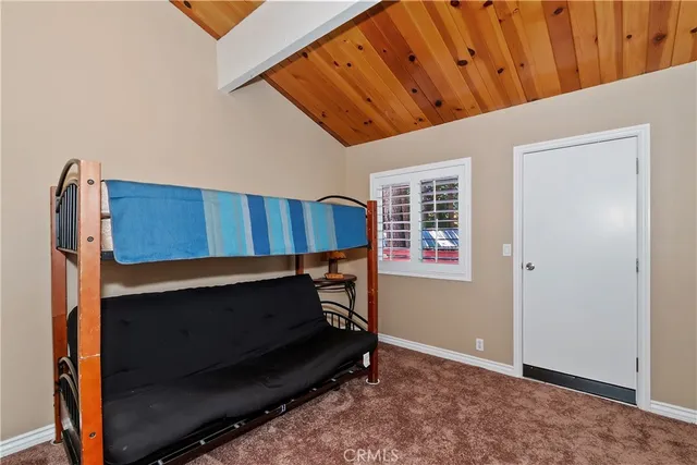 a room with wooden furniture and a window