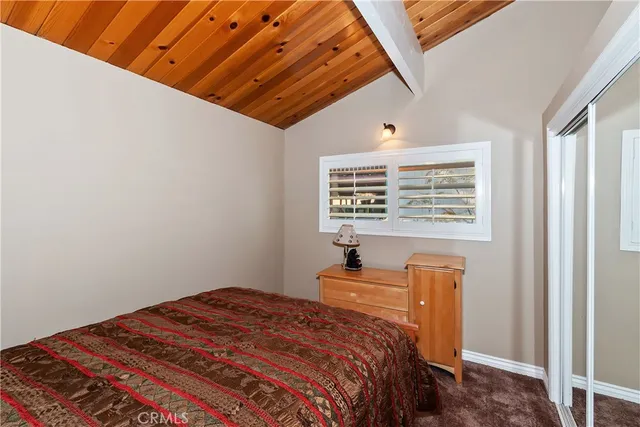 a view of balcony with wooden floor and fence