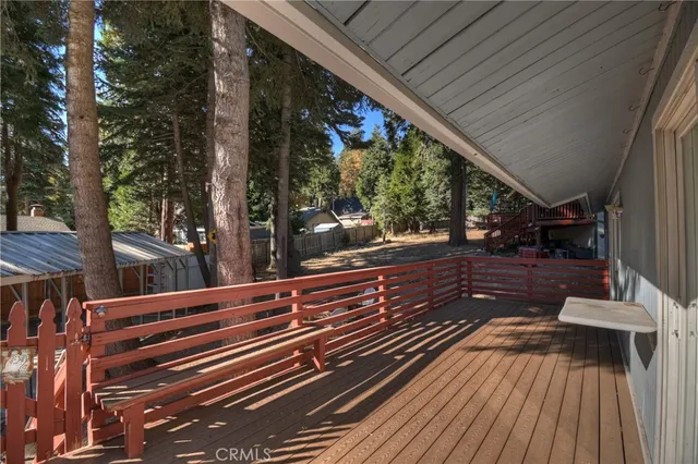 a view of a house with a yard covered in snow