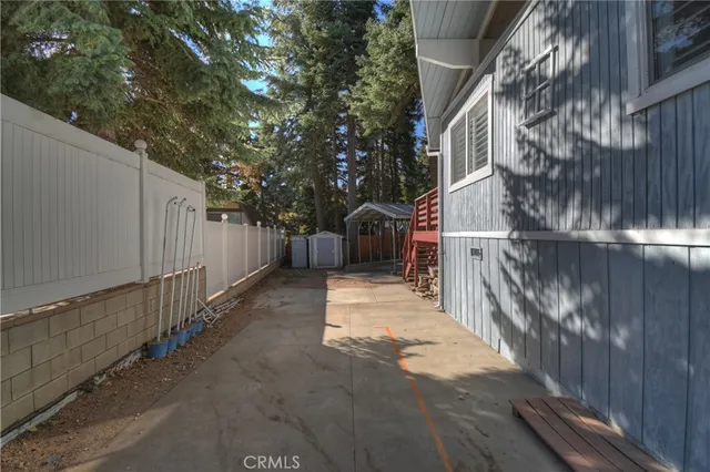 a view of a house with a yard and tree s
