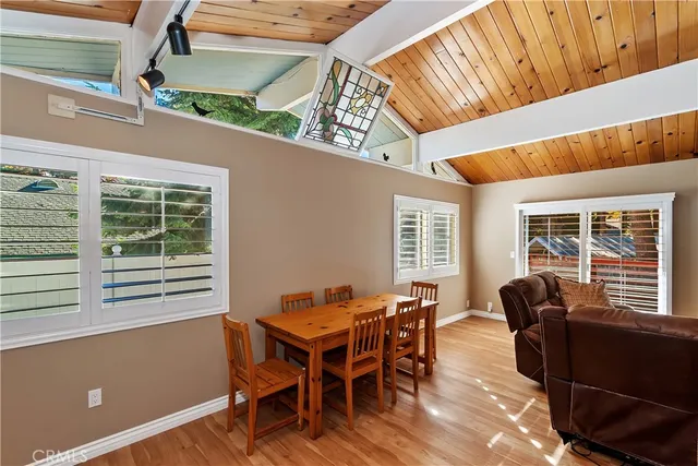 a dining room with furniture and windows