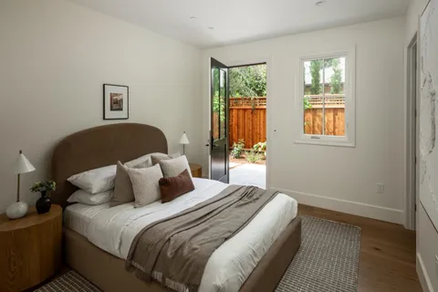 a bedroom with bed and window
