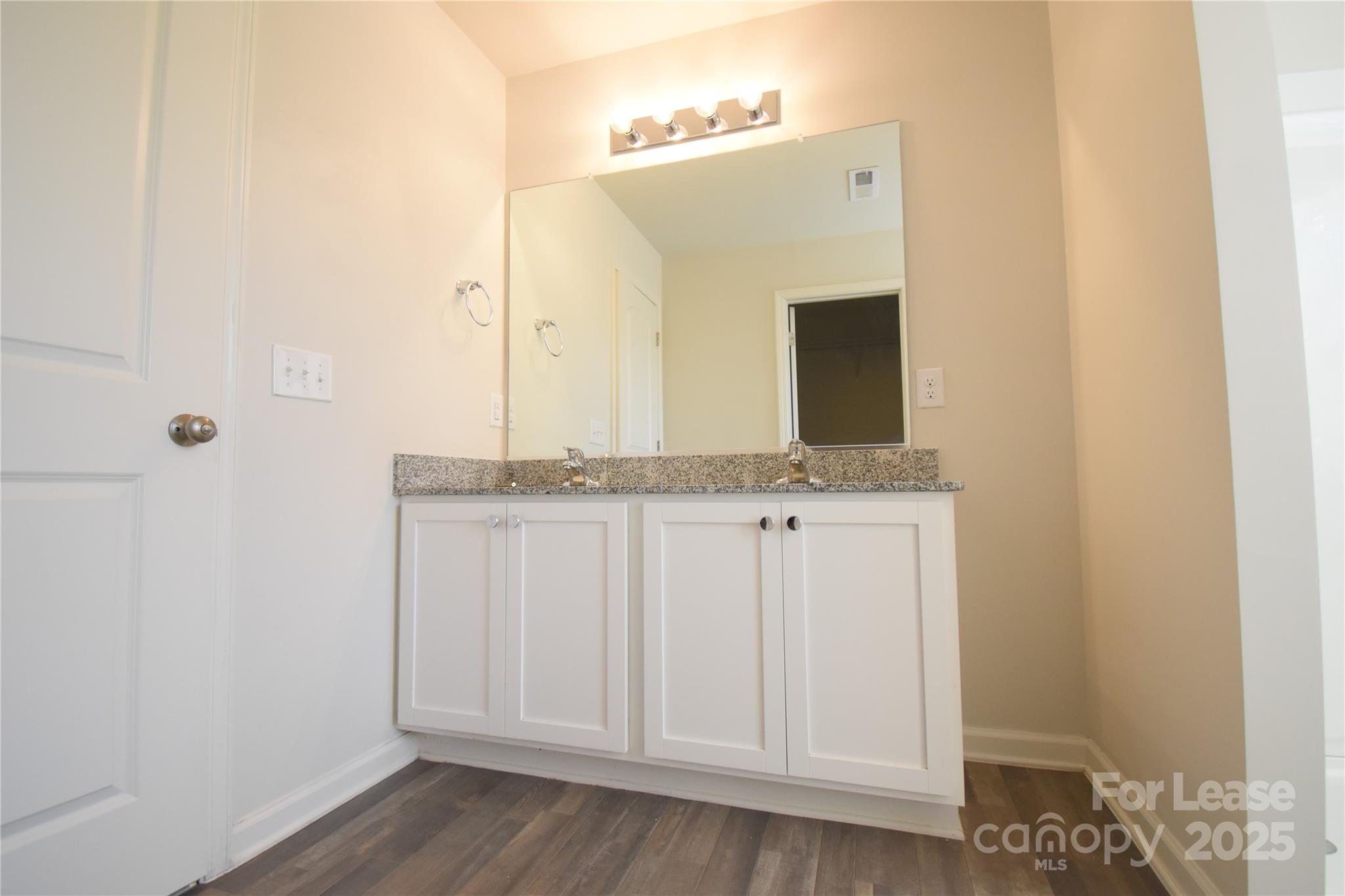 569 Calvin Sowers Road Lexington, NC 27295 - Photo 12 of 20 a bathroom with a sink and a mirror