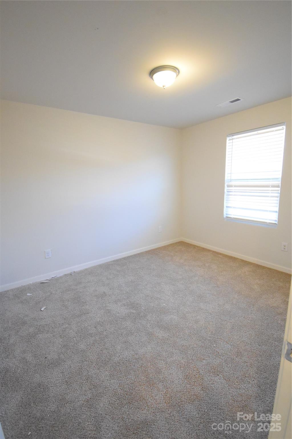 569 Calvin Sowers Road Lexington, NC 27295 - Photo 15 of 20 an empty room with a window