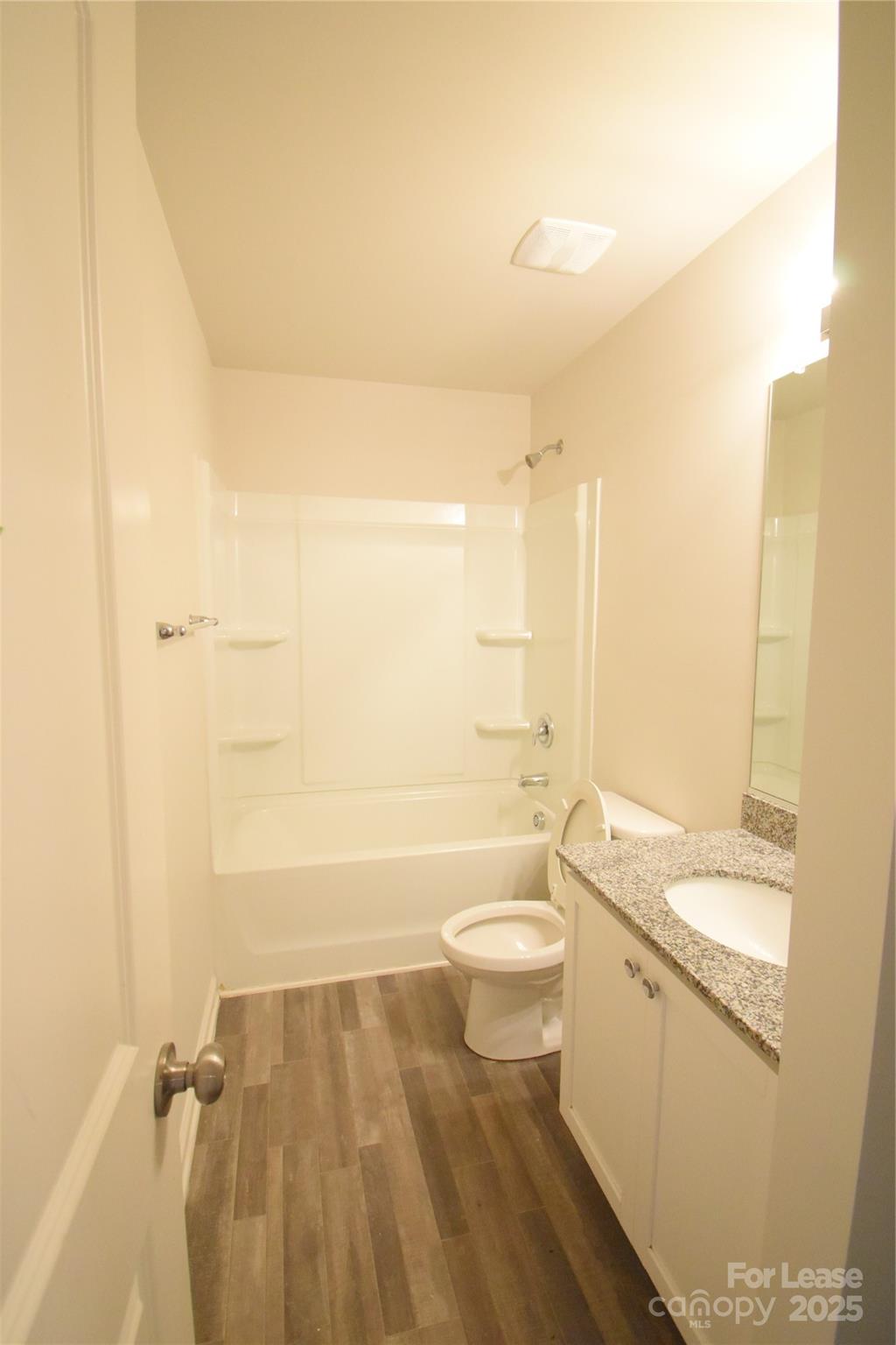 569 Calvin Sowers Road Lexington, NC 27295 - Photo 17 of 20 a bathroom with a sink a toilet and bathtub