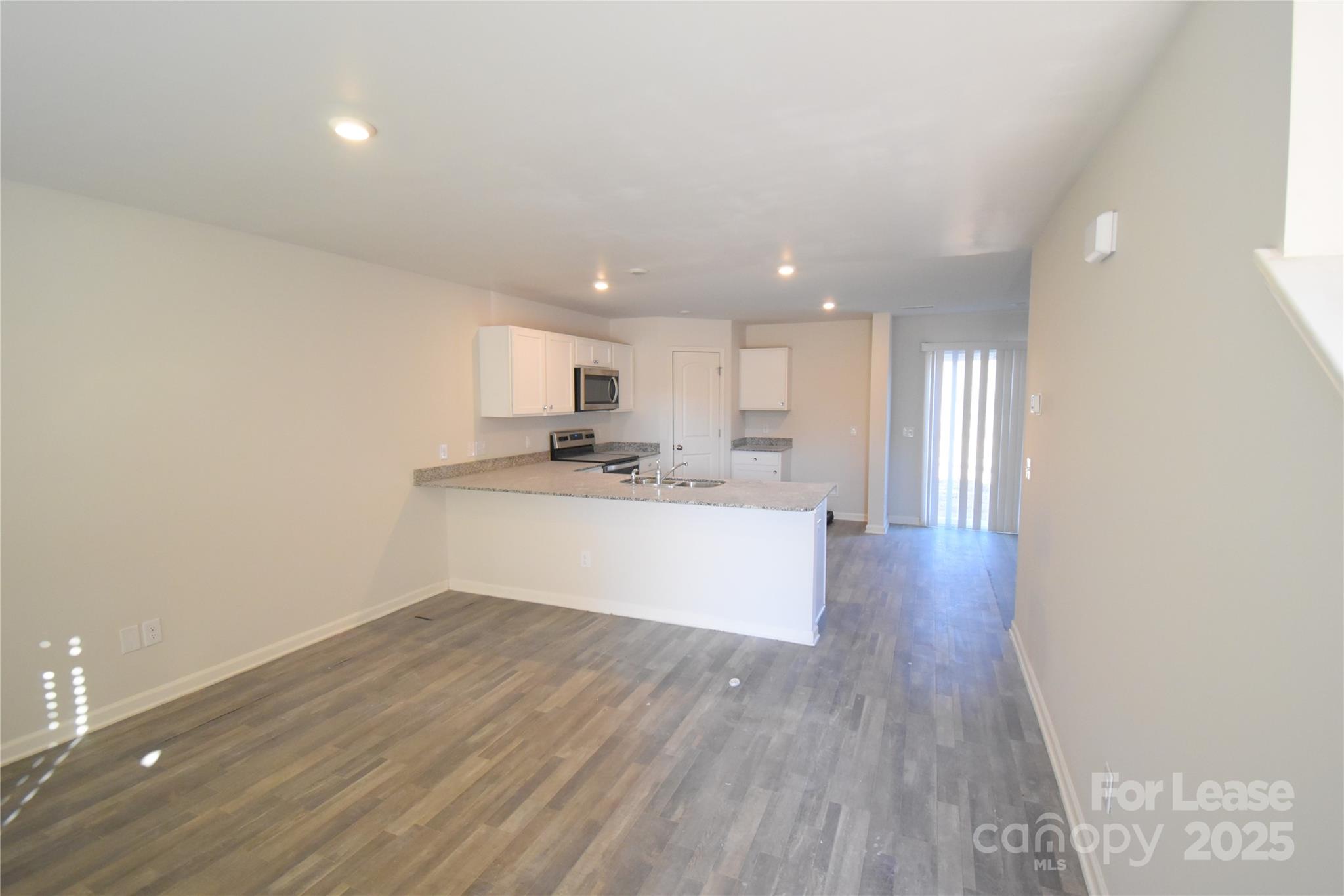 569 Calvin Sowers Road Lexington, NC 27295 - Photo 3 of 20 a view of kitchen with wooden floor