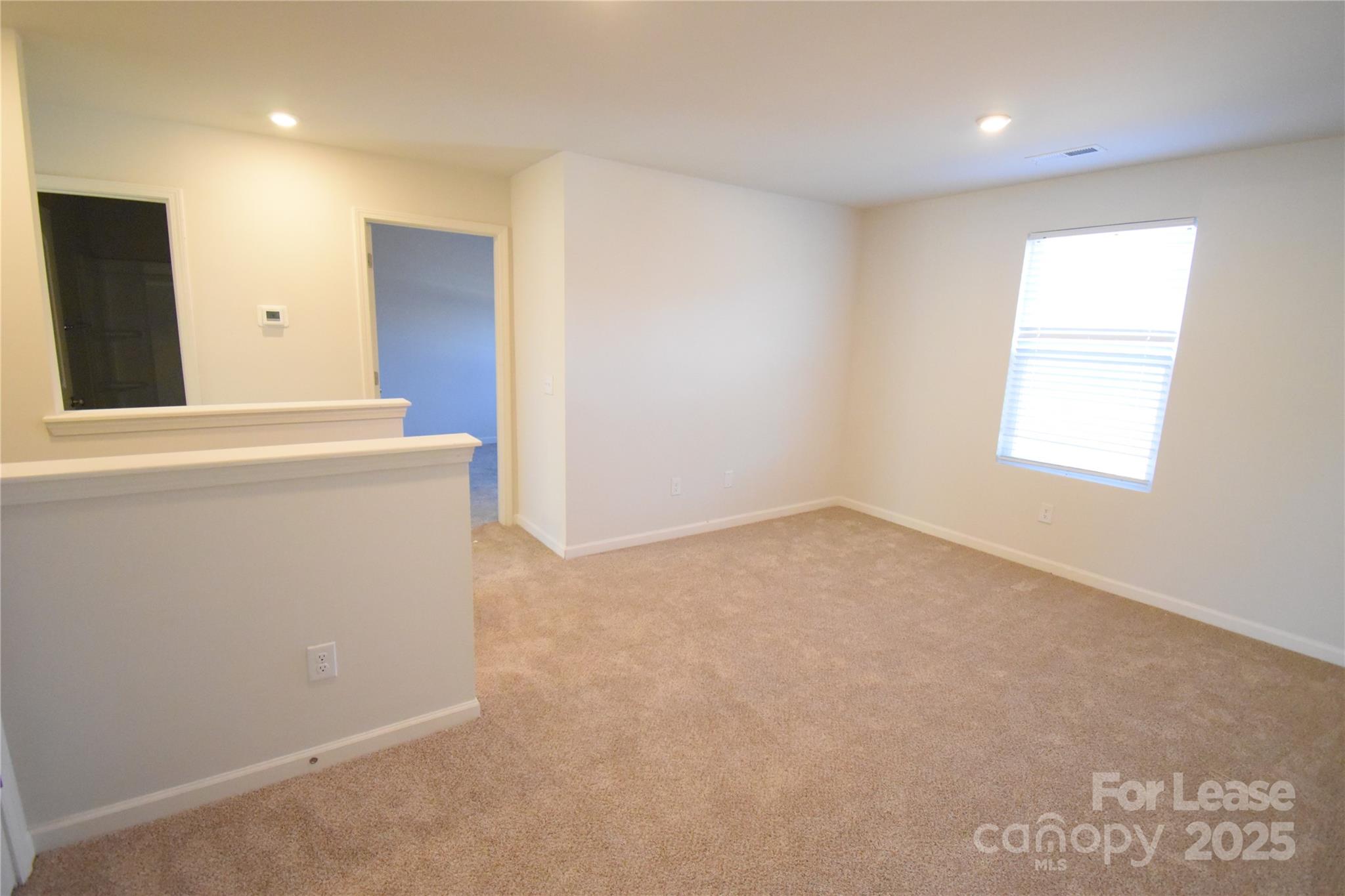 569 Calvin Sowers Road Lexington, NC 27295 - Photo 7 of 20 an empty room with windows