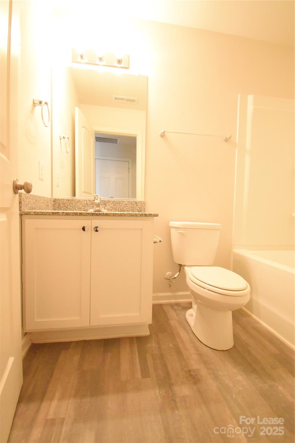 569 Calvin Sowers Road Lexington, NC 27295 - Photo 8 of 20 a white toilet sitting next to a bathroom sink