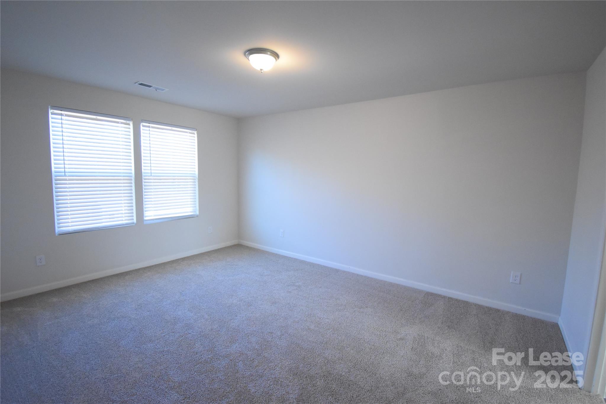 569 Calvin Sowers Road Lexington, NC 27295 - Photo 10 of 20 an empty room with a window