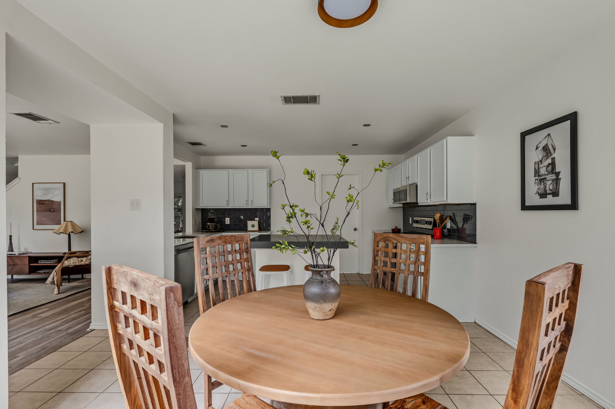1408 Water Spaniel Way Round Rock, TX 78664 - Photo 14 of 37 A well-lit breakfast area seamlessly connects to the kitchen, creating an open and inviting atmosphere.