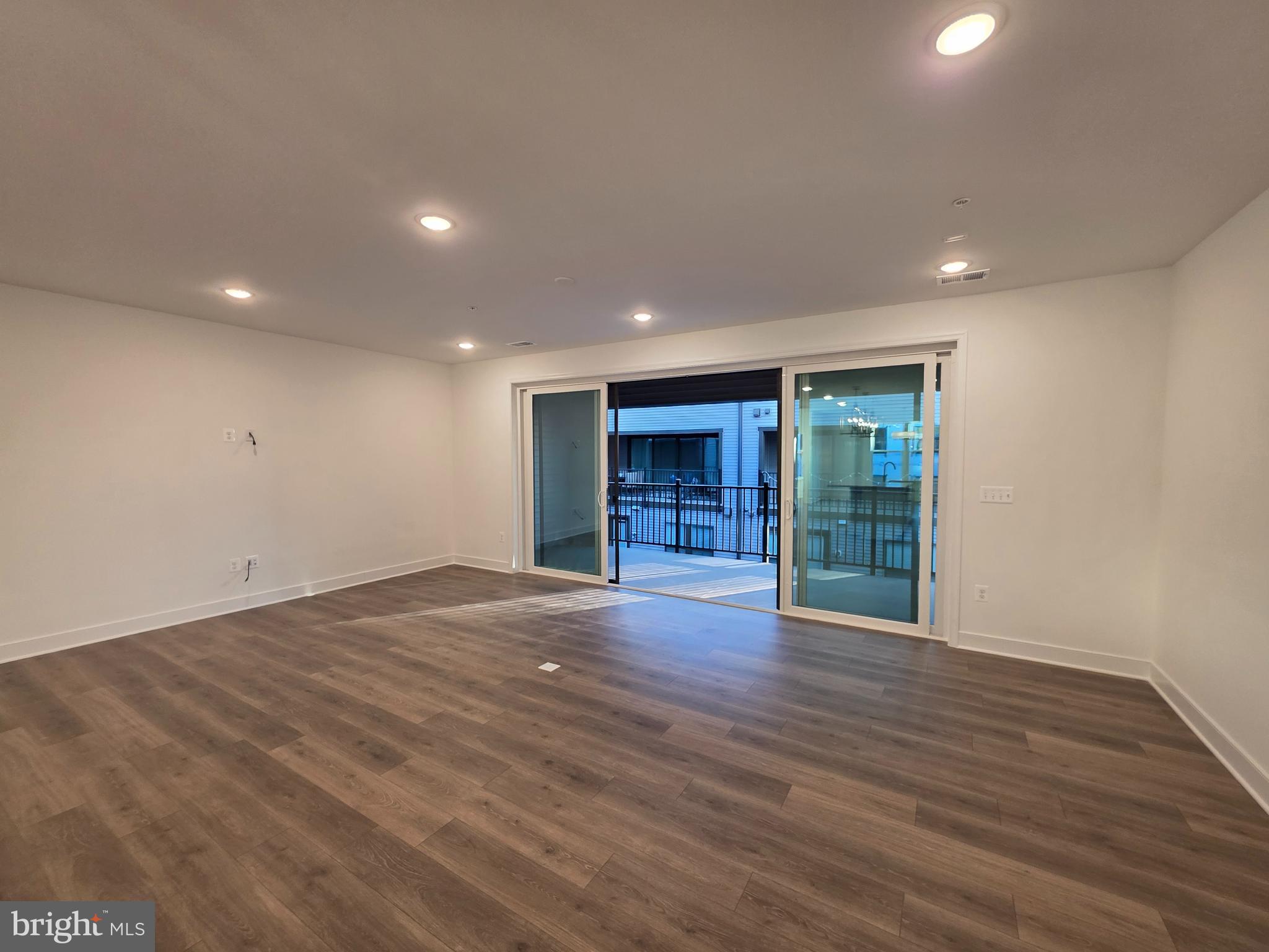 128 Locke Street, Unit B Baltimore, MD 21230 - Photo 19 of 49 a view of an empty room with wooden floor and closet
