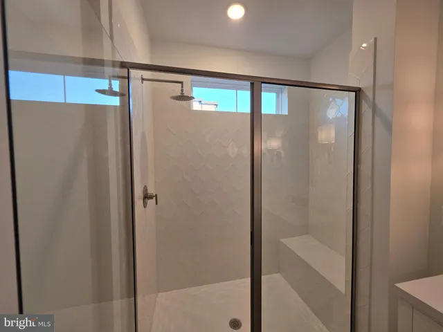 a view of a hallway with wooden floor and entryway