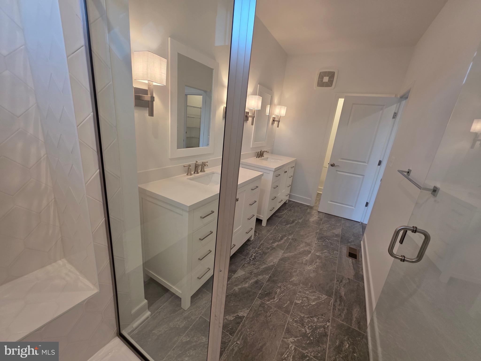 128 Locke Street, Unit B Baltimore, MD 21230 - Photo 36 of 49 a bathroom with a sink and mirror with toilet