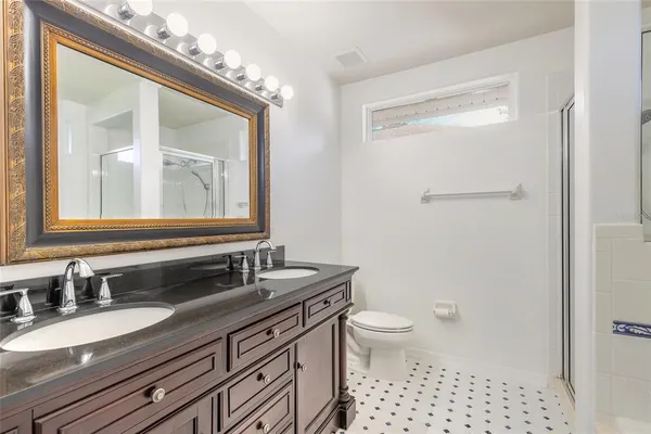 a view of a hallway with a bathroom