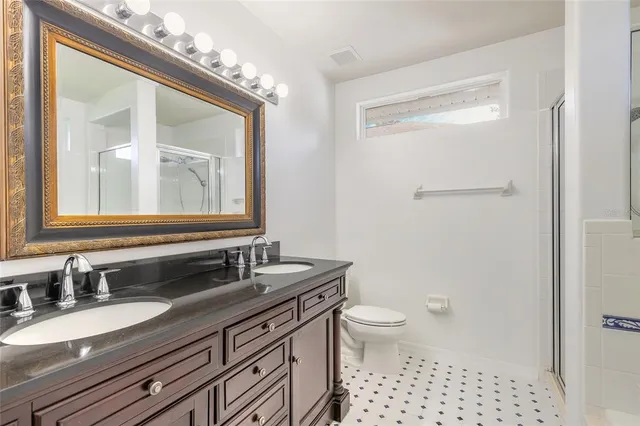 a view of a hallway with a bathroom