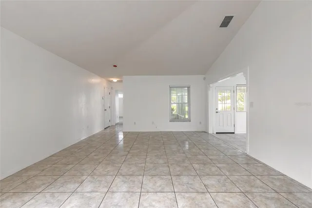 a view of a kitchen with a sink and cabinets