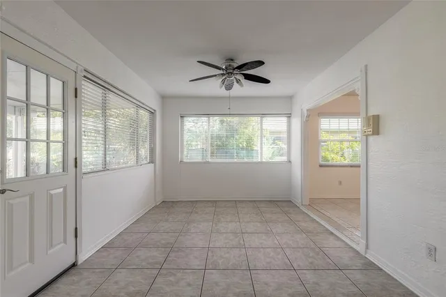 a kitchen with granite countertop a sink cabinets and stainless steel appliances