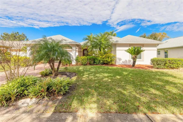 a view of a house with a yard