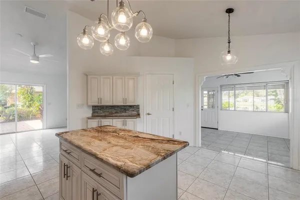 a view of a room with a table and chairs