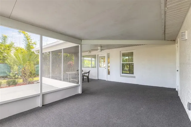 a view of a house with a swimming pool and a yard