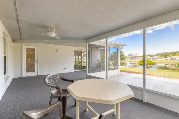 a front view of house with swimming pool and yard with green space