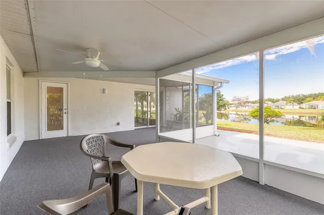 a front view of house with swimming pool and yard with green space