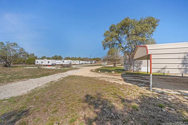 a view of a yard and front view of a house