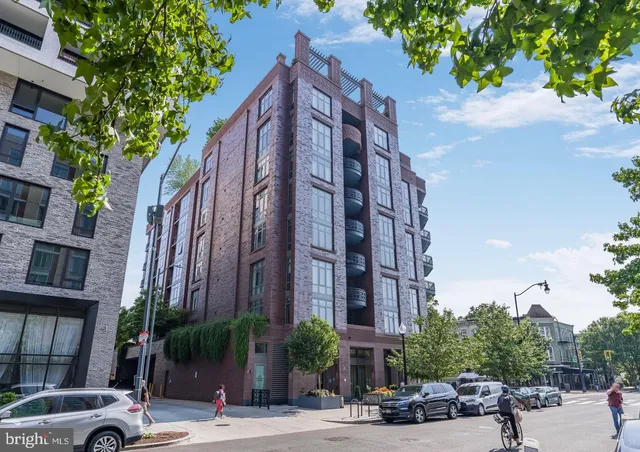a view of a buildings with a street