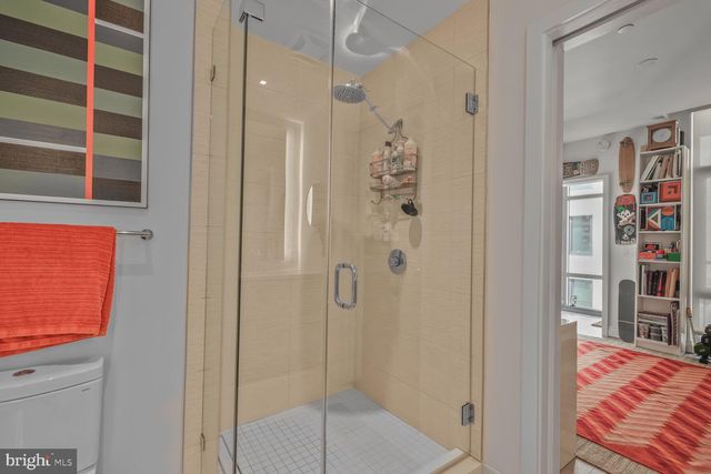 a bathroom with a shower and a sink