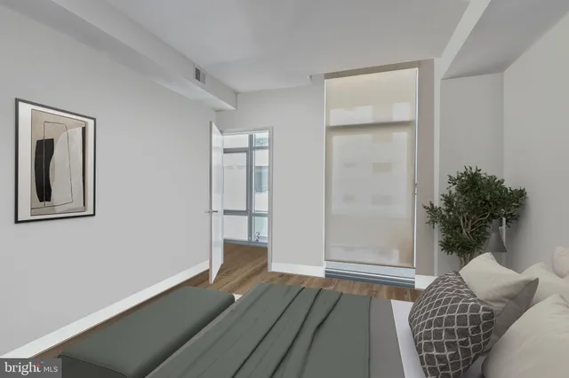 a bedroom with furniture and a window