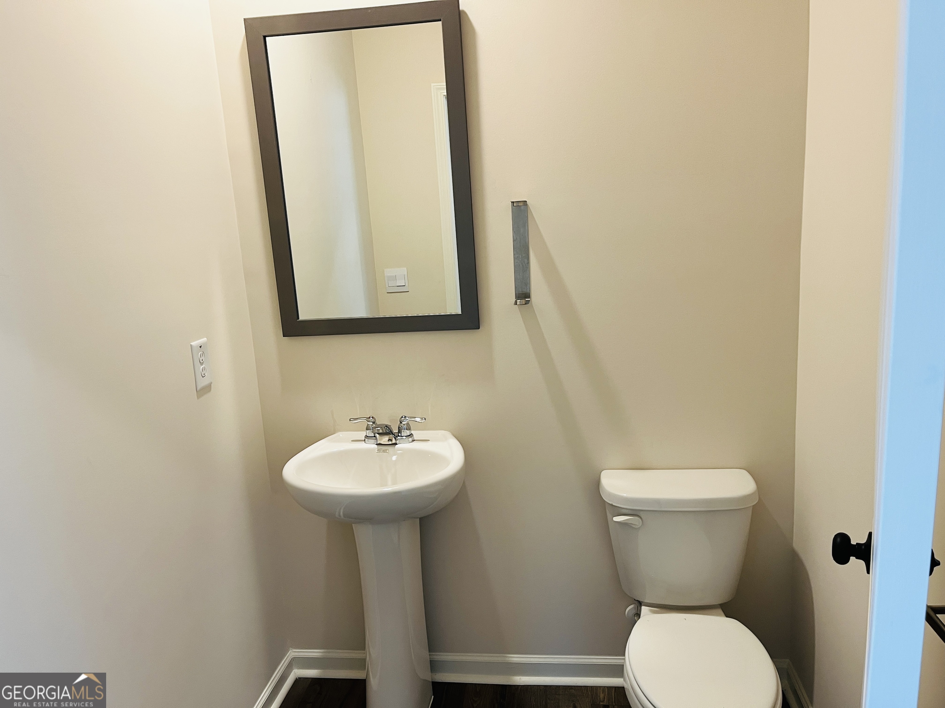 910 Sly Fox Run Fairburn, GA 30213 - Photo 12 of 46 a bathroom with a toilet sink and mirror