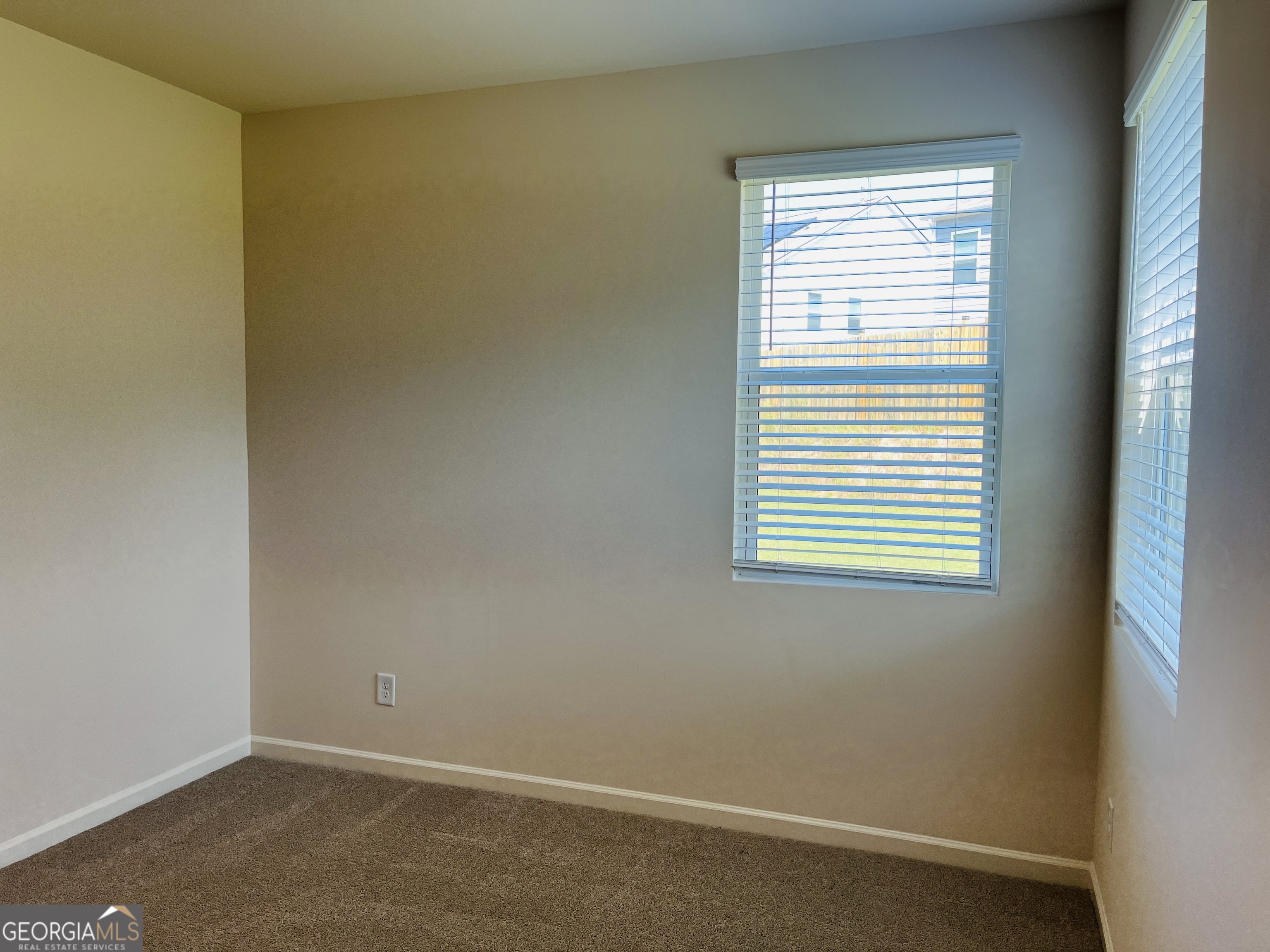 910 Sly Fox Run Fairburn, GA 30213 - Photo 16 of 46 an empty room with a window