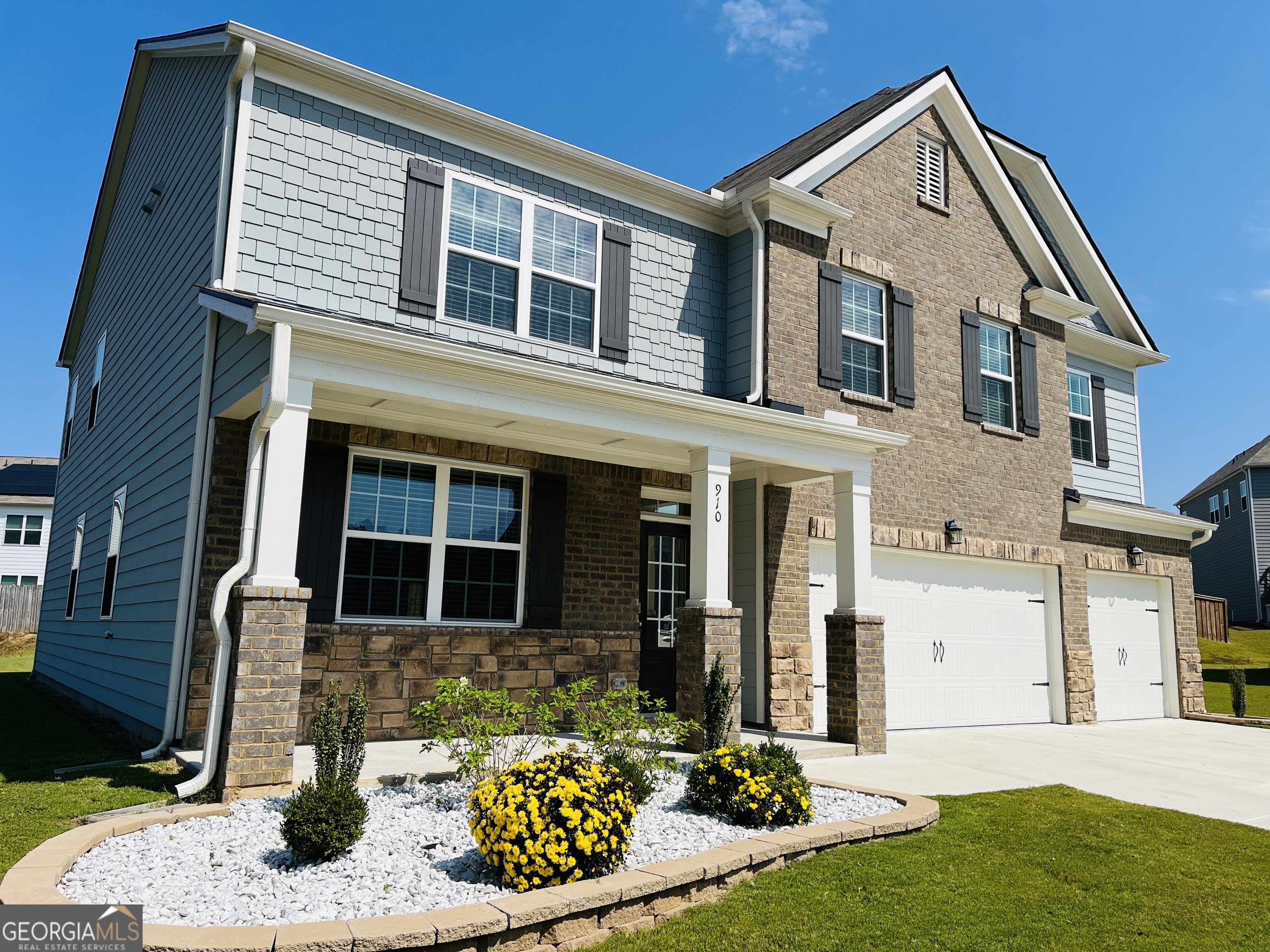 910 Sly Fox Run Fairburn, GA 30213 - Photo 2 of 46 a front view of a house with a yard