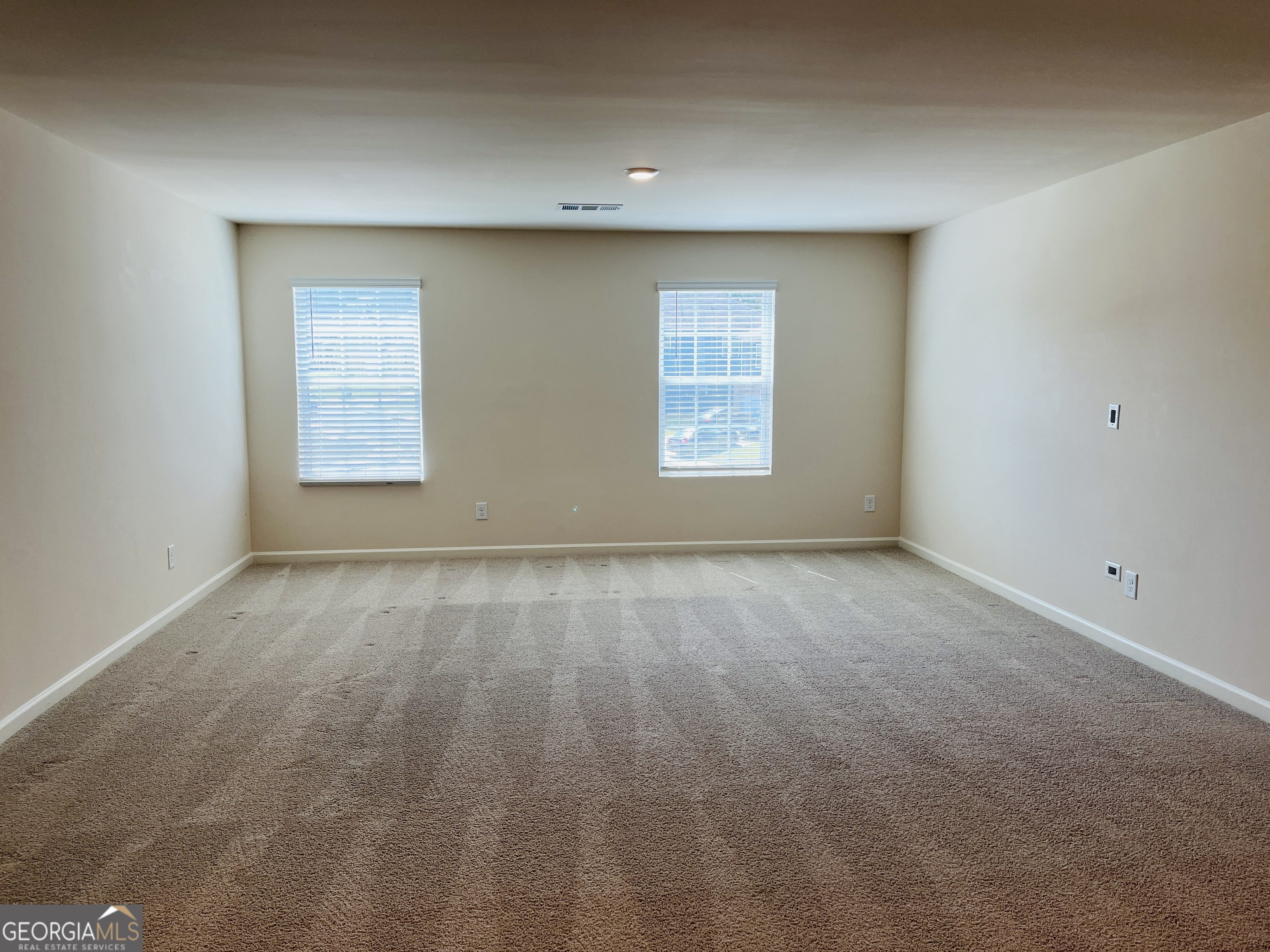 910 Sly Fox Run Fairburn, GA 30213 - Photo 21 of 46 an empty room with a window