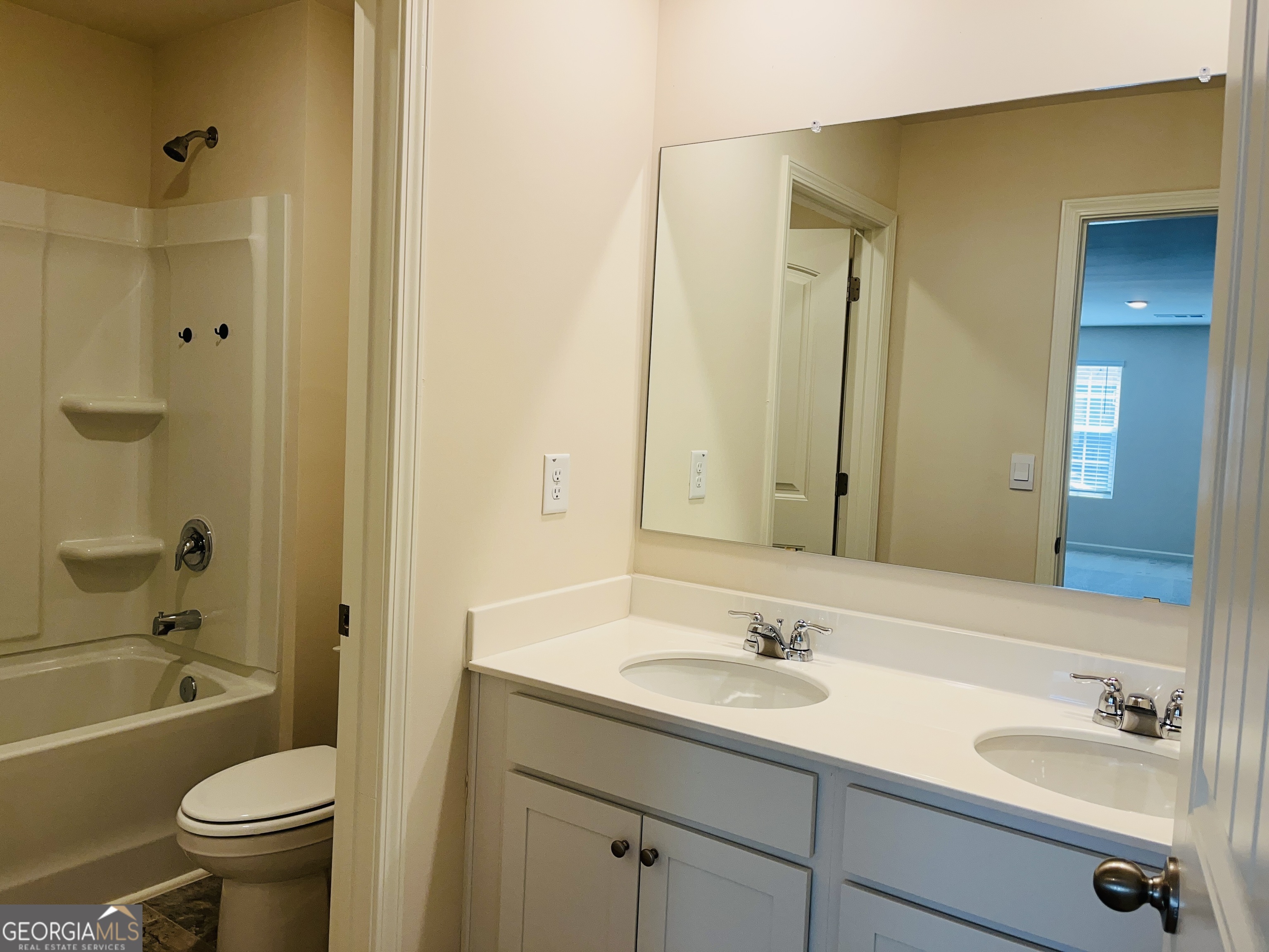 910 Sly Fox Run Fairburn, GA 30213 - Photo 23 of 46 a bathroom with a sink a toilet and shower