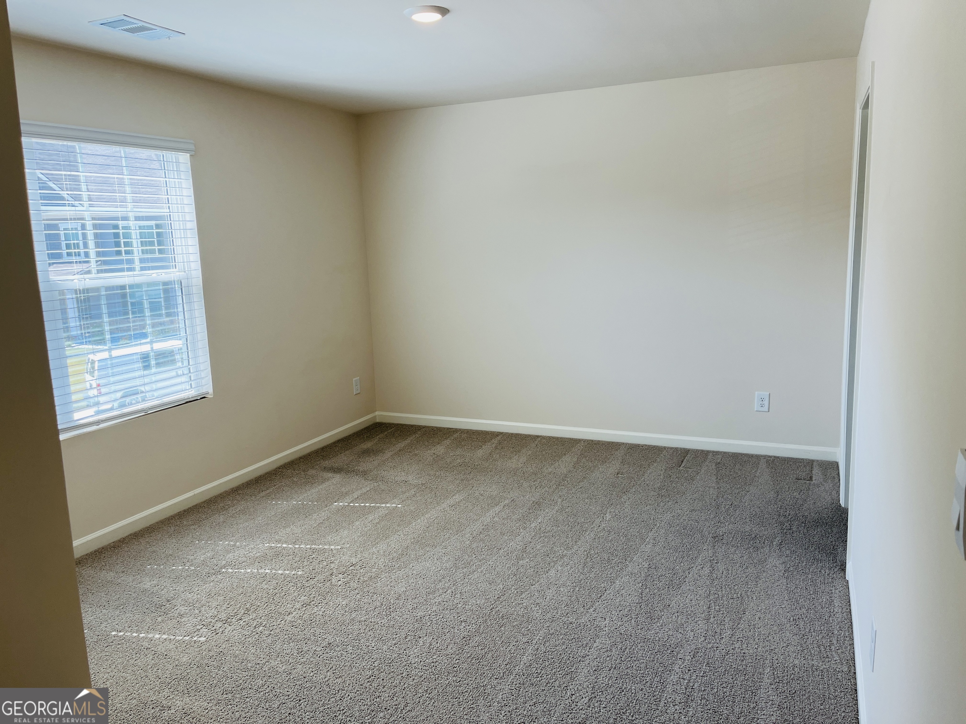 910 Sly Fox Run Fairburn, GA 30213 - Photo 25 of 46 an empty room with a window