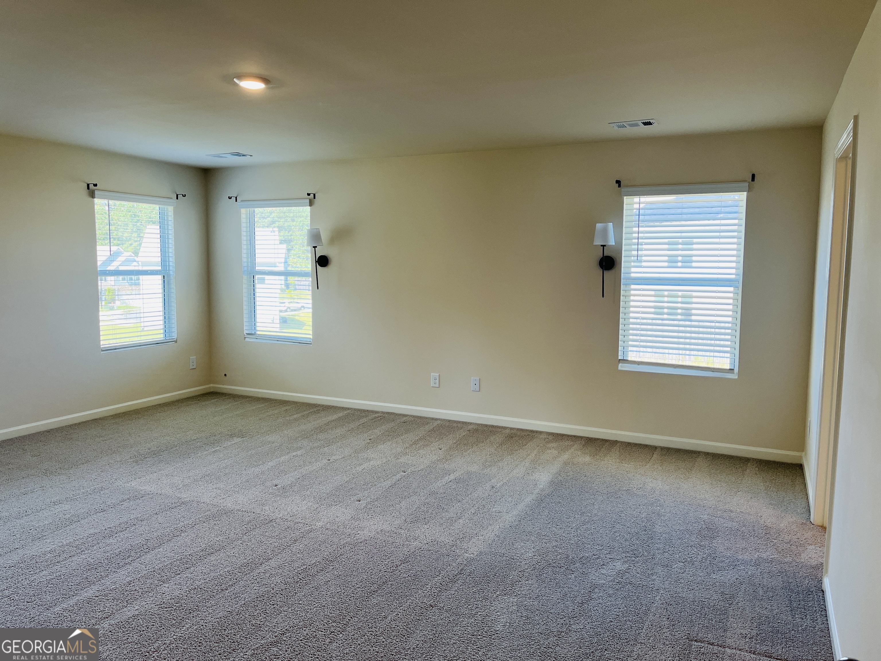 910 Sly Fox Run Fairburn, GA 30213 - Photo 29 of 46 a view of an empty room with a window