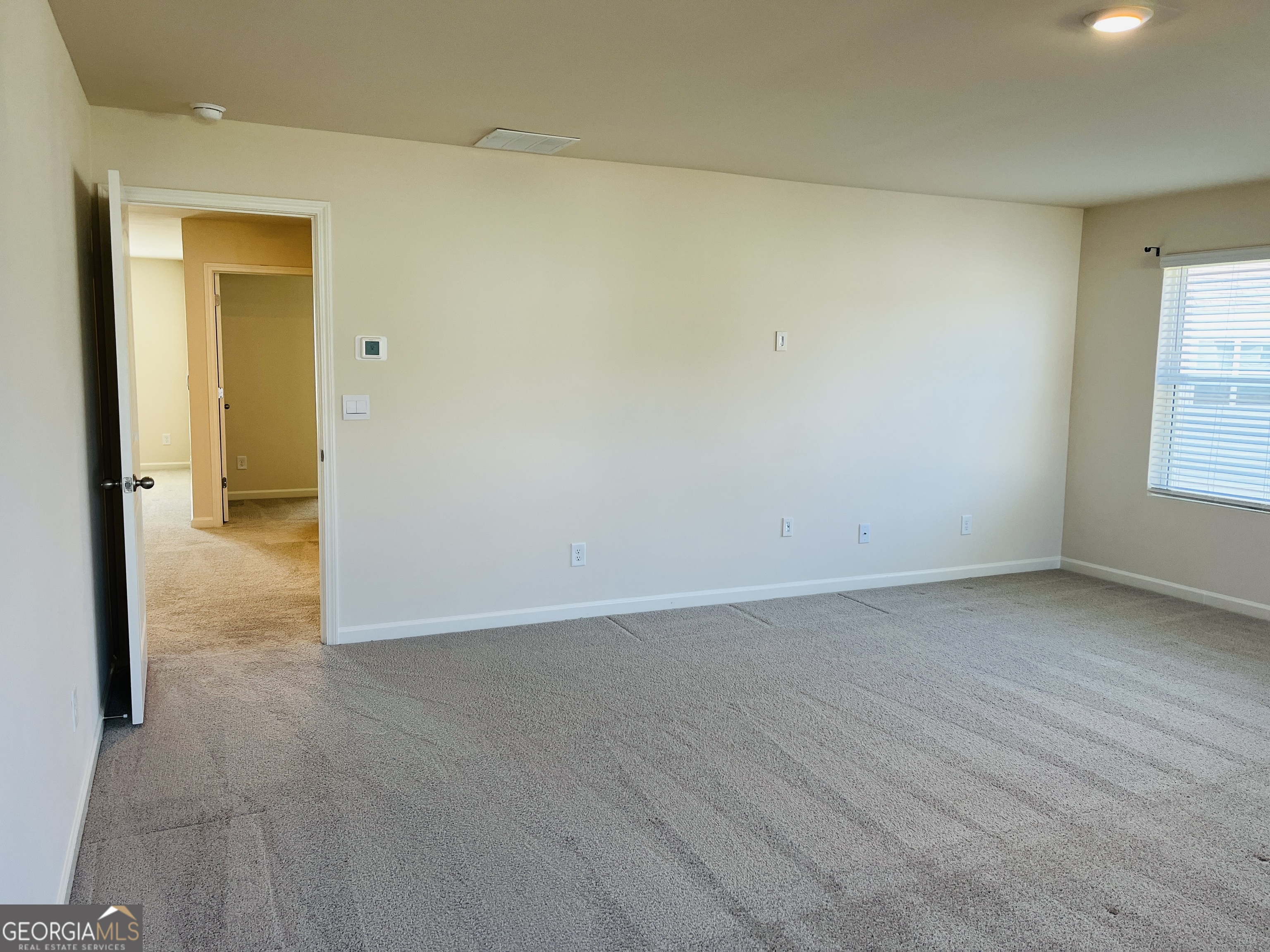 910 Sly Fox Run Fairburn, GA 30213 - Photo 31 of 46 an empty room and window