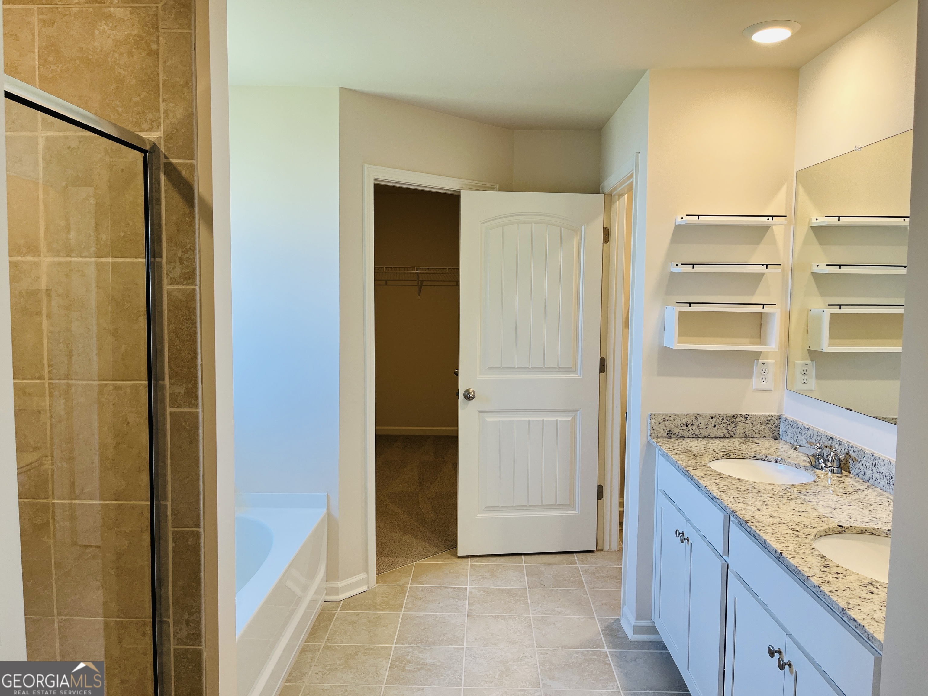 910 Sly Fox Run Fairburn, GA 30213 - Photo 33 of 46 a bathroom with a granite countertop sink and shower