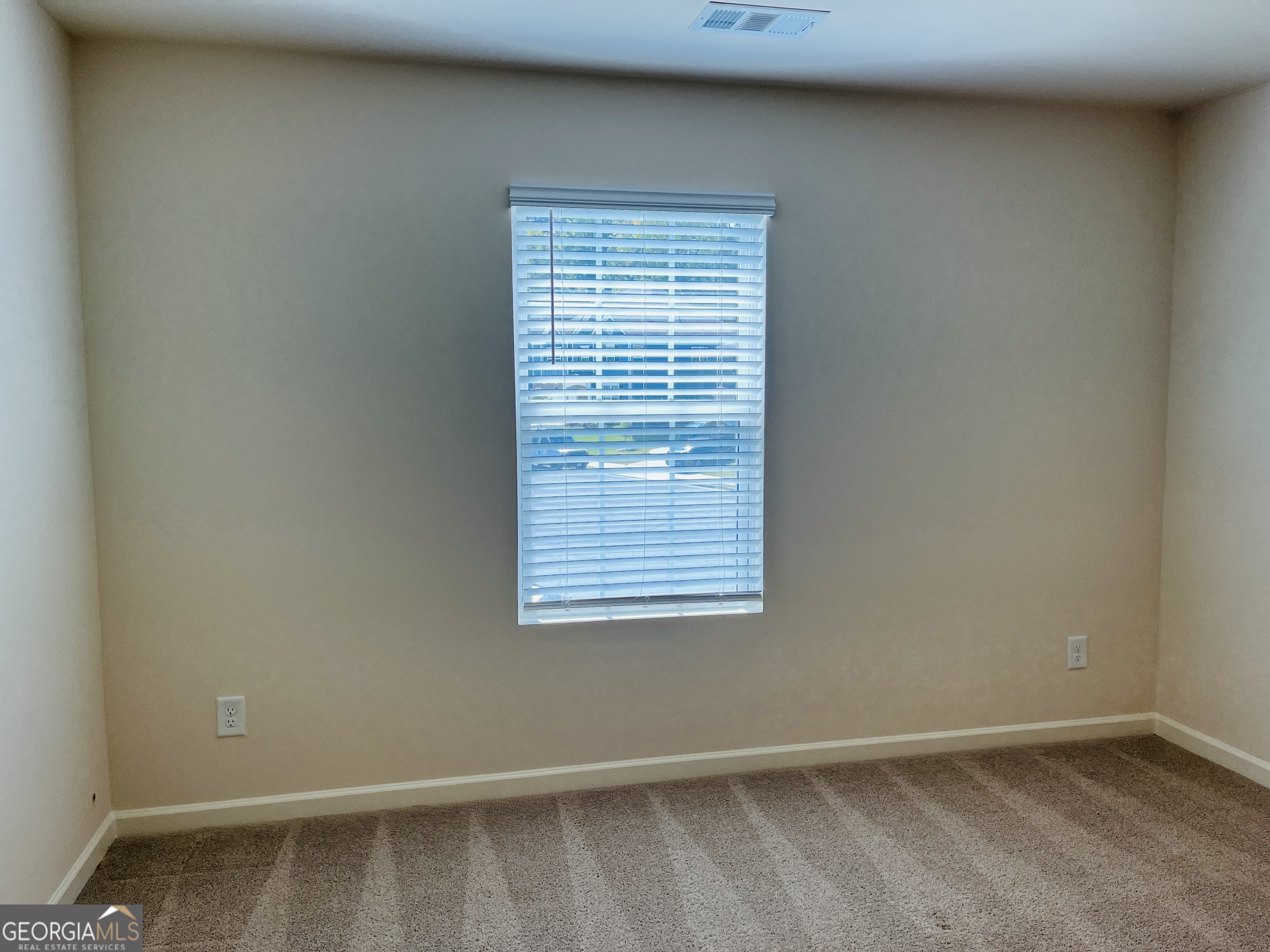 910 Sly Fox Run Fairburn, GA 30213 - Photo 40 of 46 a view of an empty room with a window