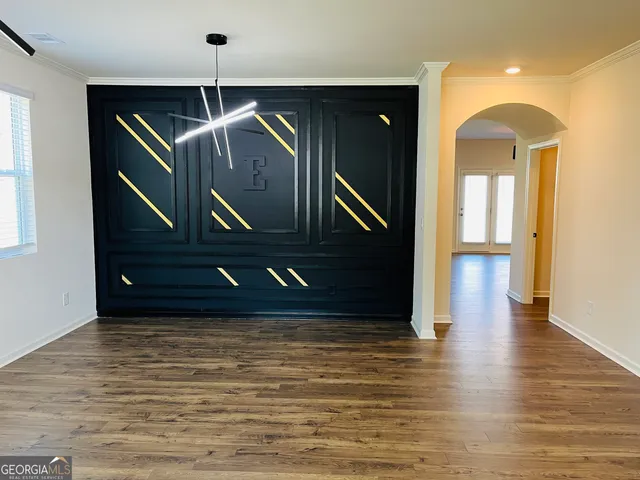 a view of entryway with wooden floor