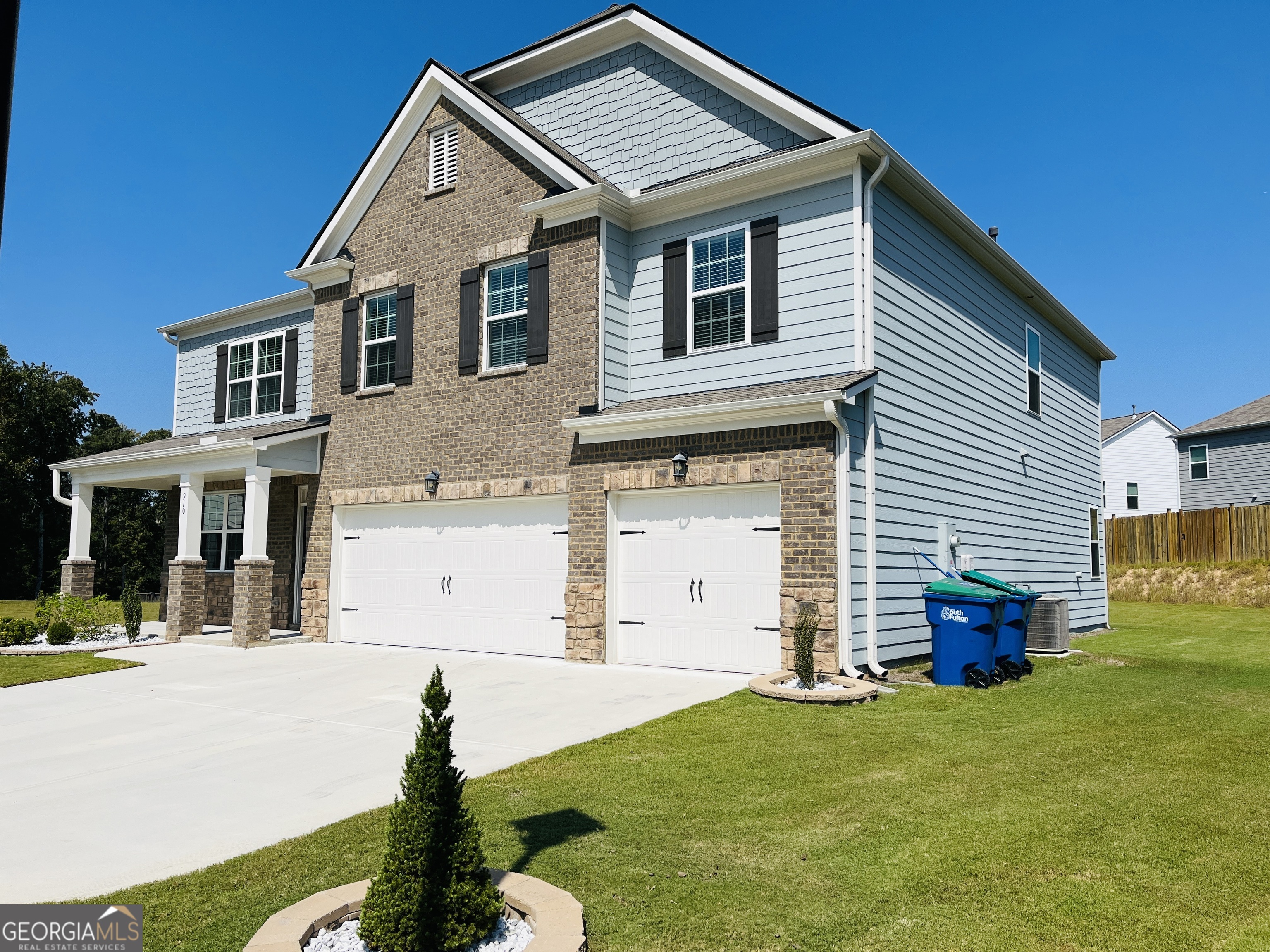910 Sly Fox Run Fairburn, GA 30213 - Photo 43 of 46 a view of a house with backyard and garden