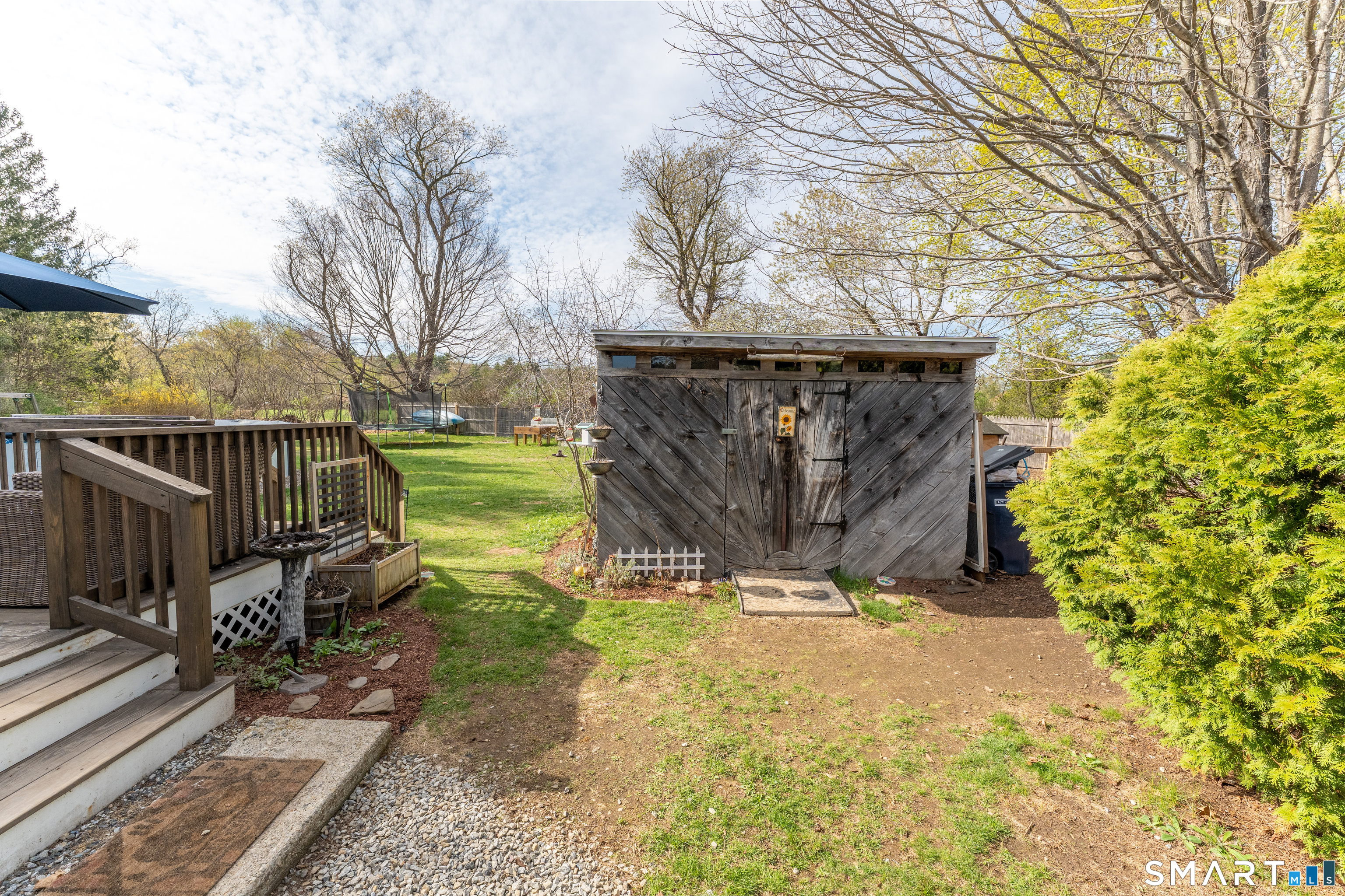 14 Liberty Lane Thompson, CT 06277 - Photo 13 of 39 a view of a garden with wooden fence