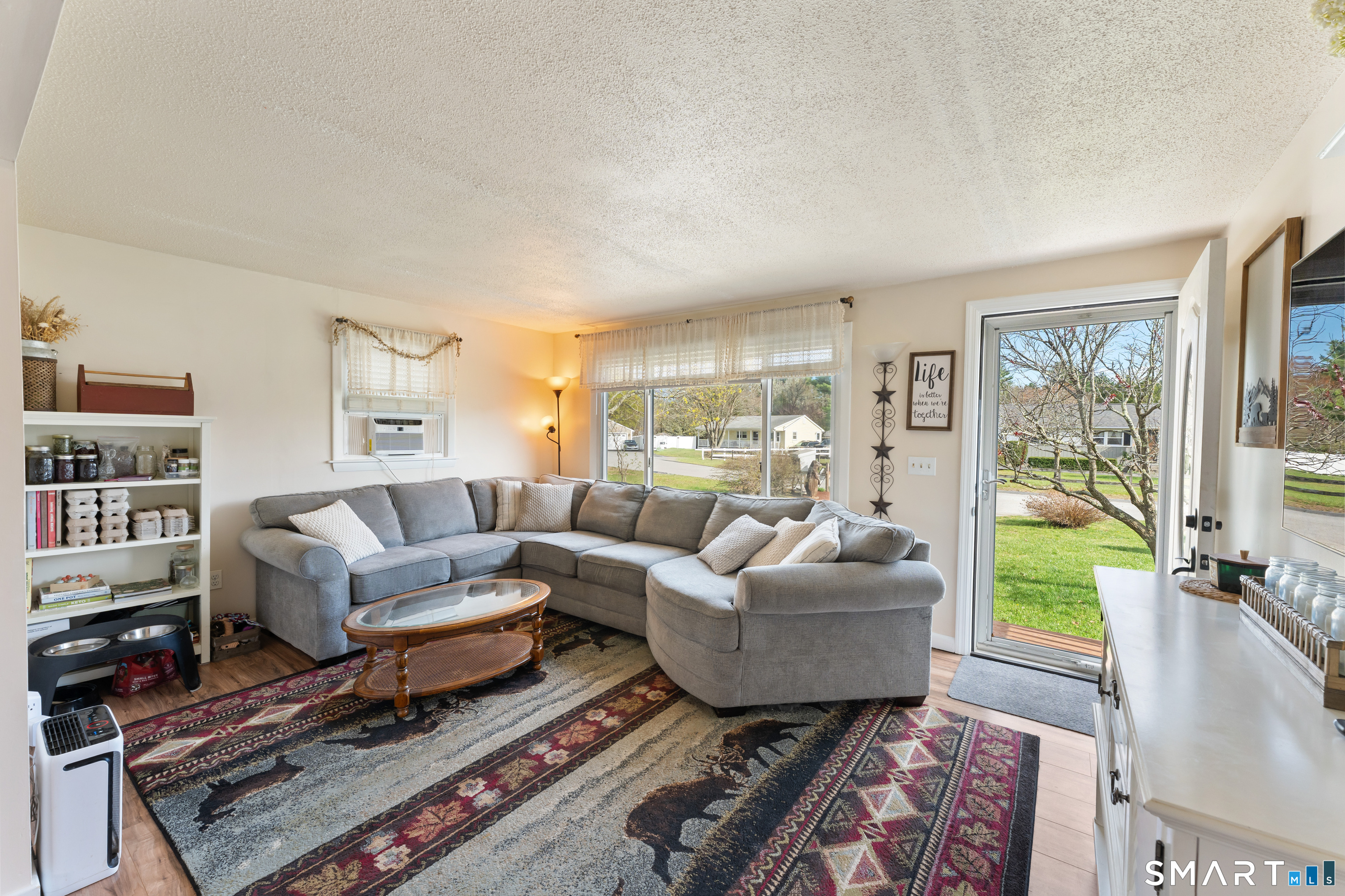 14 Liberty Lane Thompson, CT 06277 - Photo 15 of 39 a living room with furniture and a large window