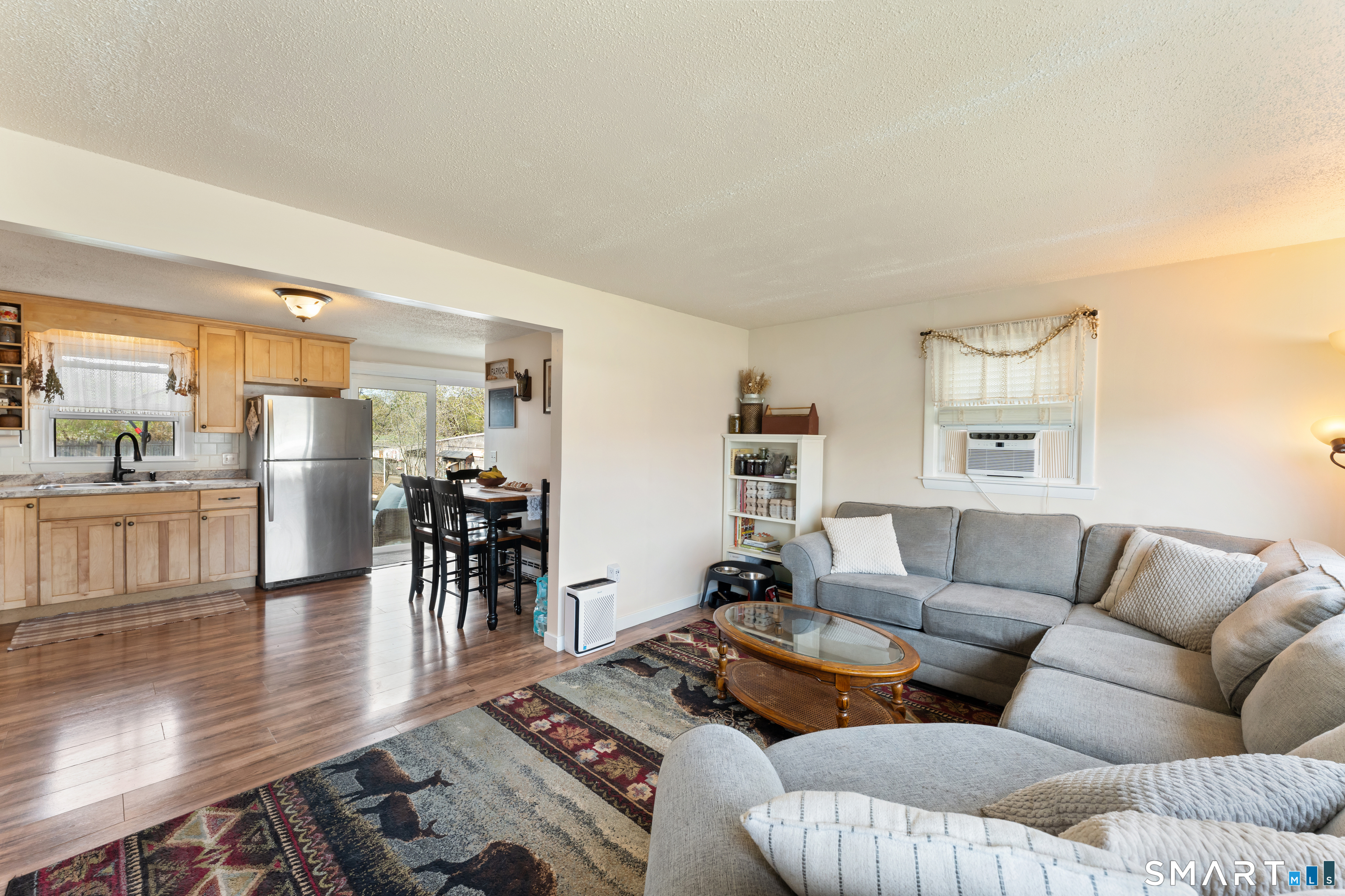14 Liberty Lane Thompson, CT 06277 - Photo 17 of 39 a living room with furniture wooden floor and a table