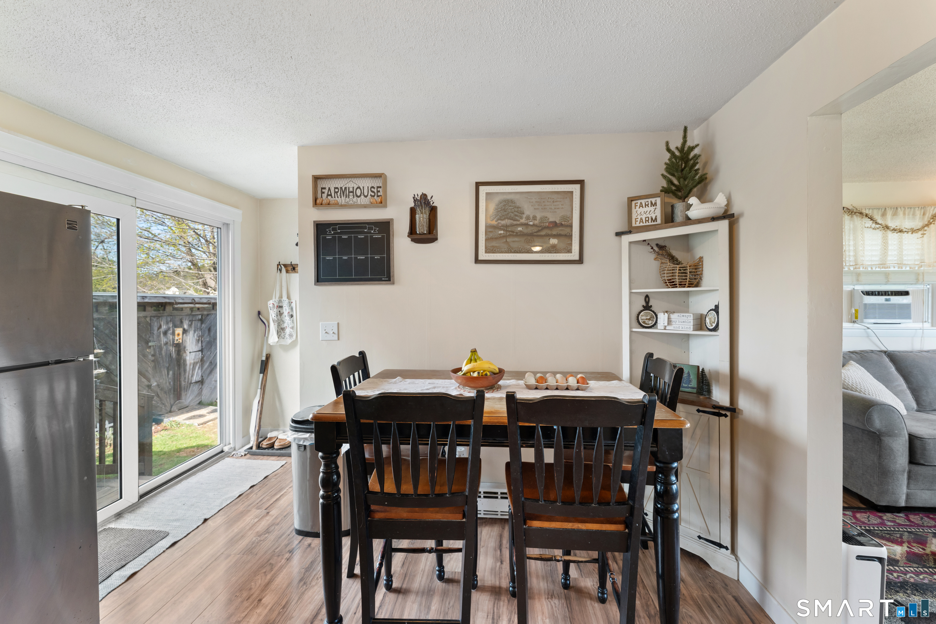 14 Liberty Lane Thompson, CT 06277 - Photo 21 of 39 a view of a dining room with furniture window and wooden floor
