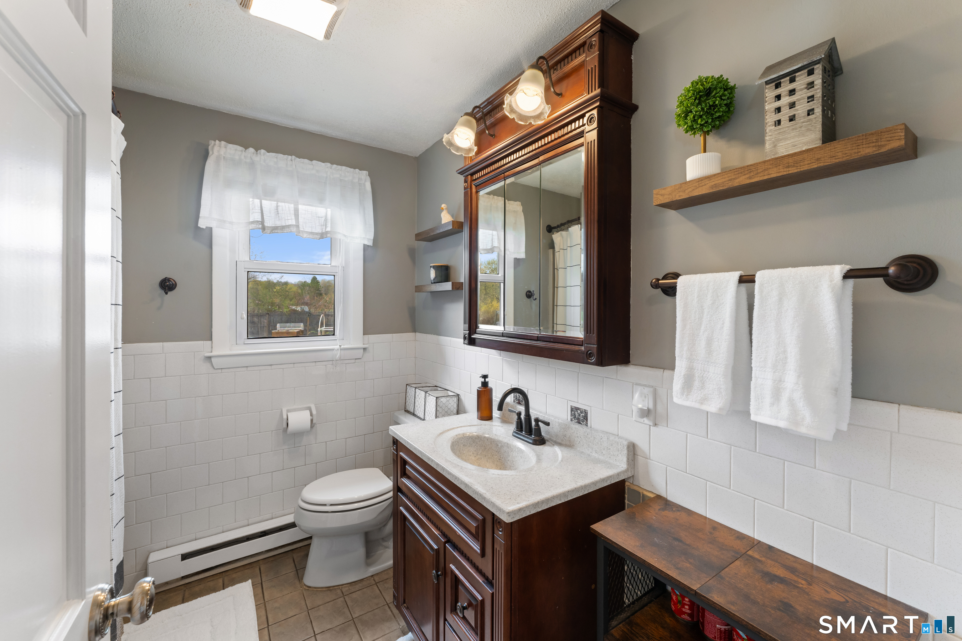 14 Liberty Lane Thompson, CT 06277 - Photo 25 of 39 a bathroom with a sink toilet and mirror