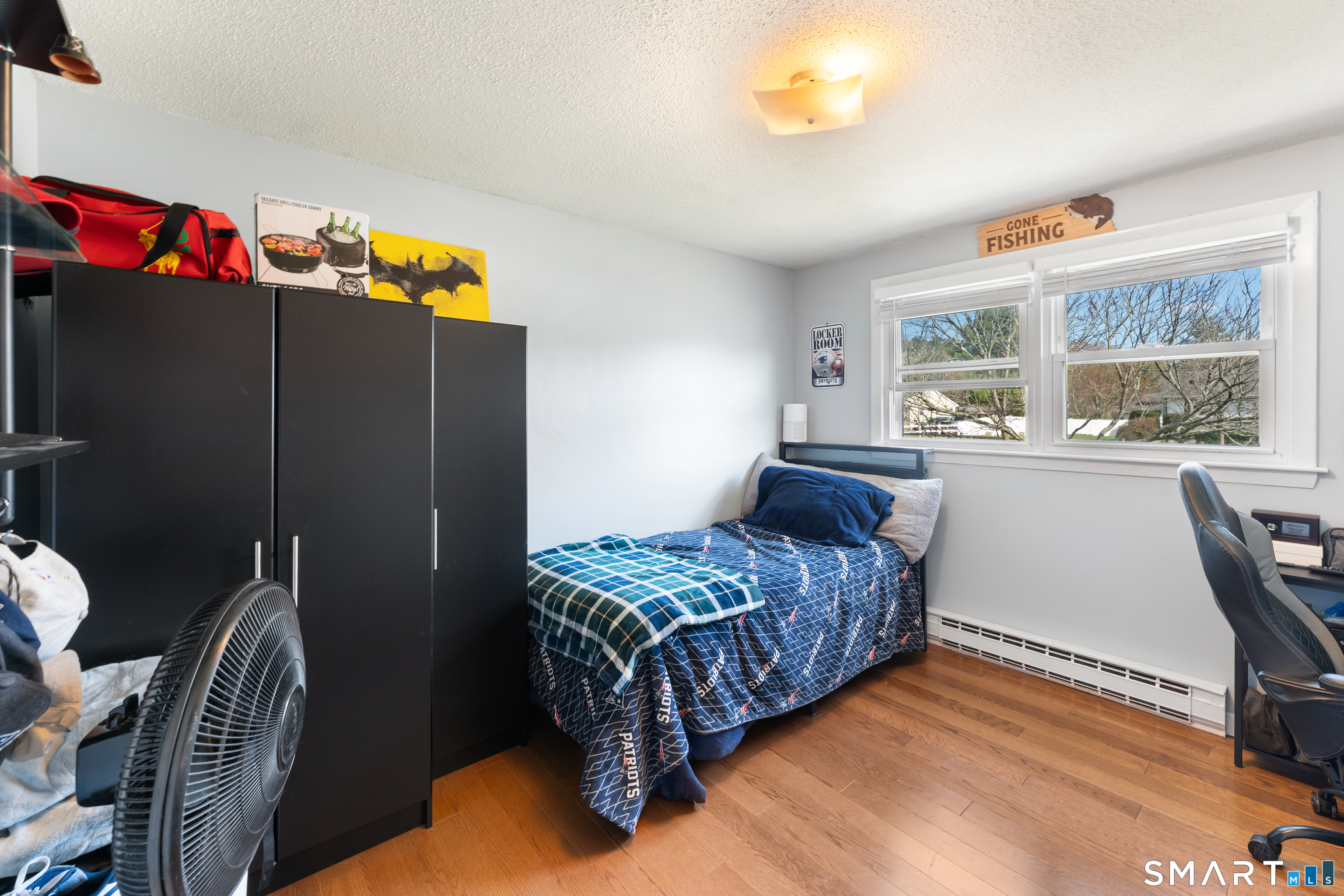 14 Liberty Lane Thompson, CT 06277 - Photo 29 of 39 a bedroom with a bed closet and a large window