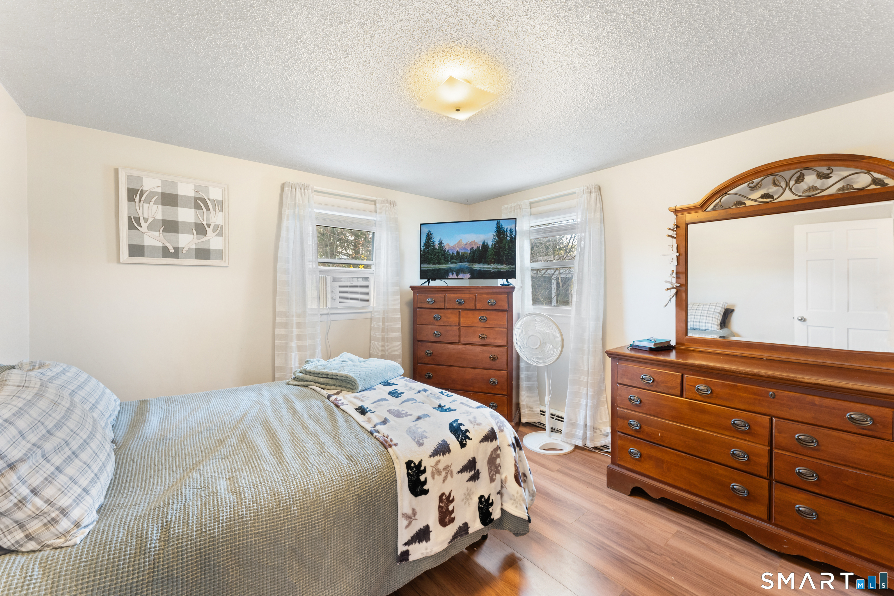 14 Liberty Lane Thompson, CT 06277 - Photo 31 of 39 a bedroom with a bed and a dresser